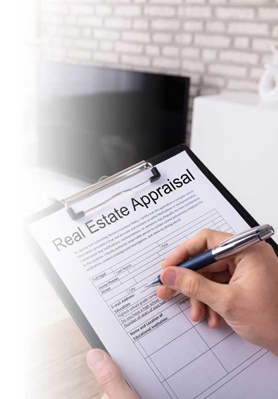 appraisal-real-estate-img Man holding a clip board conducting a Real Estate Appraisal